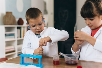 children do chemical experiments from kitchen ingredients at home