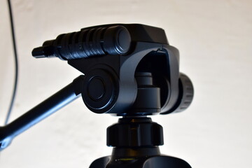 fragment of a camera tripod in contrasting light