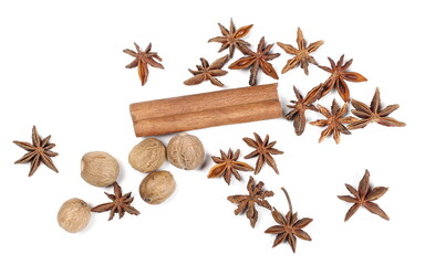 Fototapeta na wymiar Cinnamon stick with anise stars and nutmeg pile isolated on white background, top view