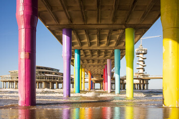 Famous Pier from Scheveningen Strand, Den Haag - HOLLAND, the Netherlands. Under the pier and pier has colorful pillar