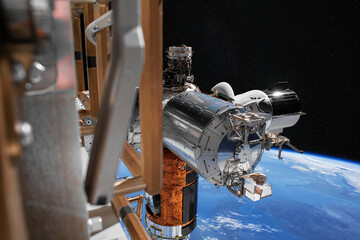 The SpaceX Crew Dragon spacecraft is docked to the International Space Station. Elements of this image furnished by NASA