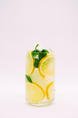 Lemonade with ice and mint on a white background