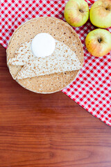 Russian pancake blini with  fresh cream   on  wooden background