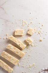 Homemade organic halva is dessert of Turkey. Sliced halva on the table. 