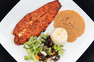 Overhead view of zarandeado fillet fish split in half in the traditional way of Mexico for a...