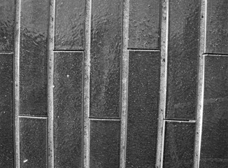 evocative black and white image of rectangular wall tiles