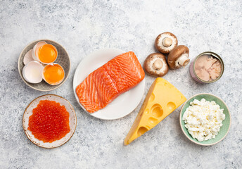 Selection of natural sources of vitamin D: fresh salmon, caviar, cheese, mushrooms, tuna, eggs on...