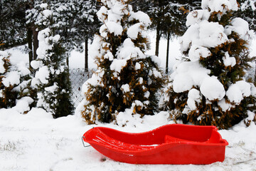 View of a red sledge in a winter landscape