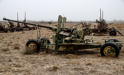 Old armoured vehicles military escorts, guns and tanks in Gardez in Afghanistan