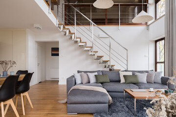 Spacious living room with stairs