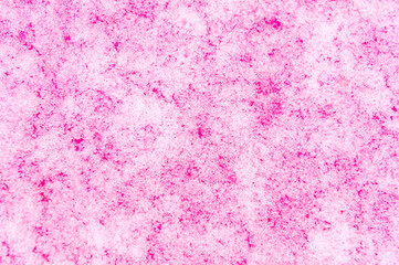 London, United Kingdom, January 25, 2021: Airy delicate bubbles flowing through ice with pink colour. Ideal for background
