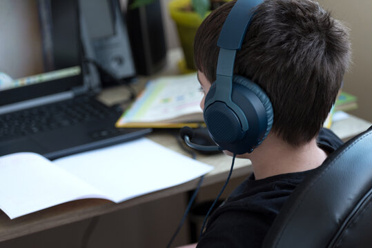 Distance Learning, Online Education. School Boy Studying At Home And Doing Homework. Selective Focus