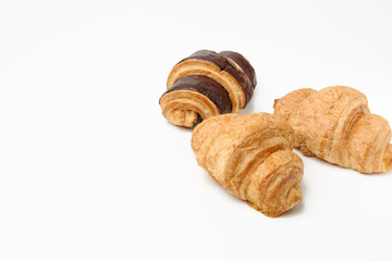 baked chocolate croissant made from white wheat flour on white background
