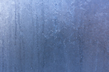 Frozen window, frosty pattern on the glass. 