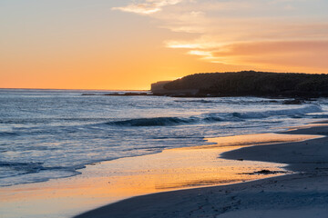 Fototapeta na wymiar Sunset over the beach