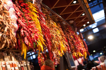 sweet and hot dried peppers bunches on market
