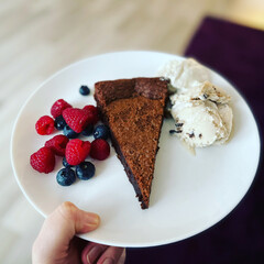chocolate cake with berries and icecream
