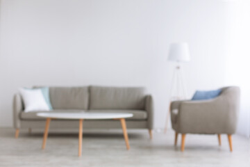 Blurred photo of home office and living room in style of minimalism