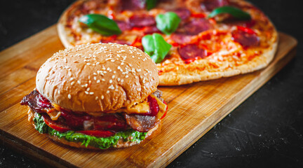 bacon cheese burger with beef patty tomato onion and Pizza with Mozzarella cheese, Ham, Tomatoes, salami, pepper, pepperoni Spices and Fresh Basil