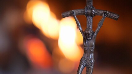 Crucifix Silhouette on Fire Flames Defocused Dark Background Slow Motion