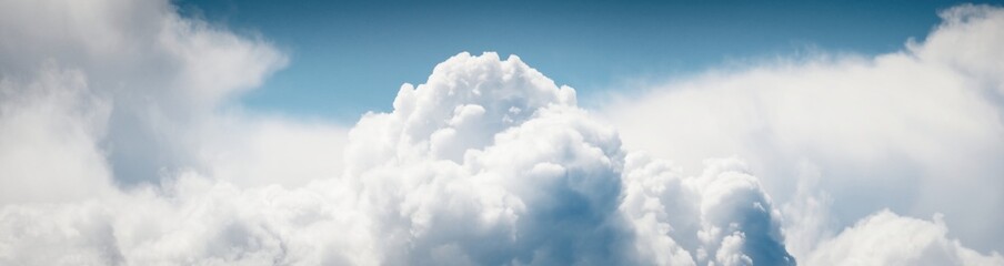 Clear blue sky with glowing white cumulus clouds. Midday sun. Panoramic dramatic cloudscape. Concept art, meteorology, climate change, religion, heaven, hope, peace, graphic resources