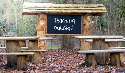 A classroom in the forest. Teaching during the corona pandemic.