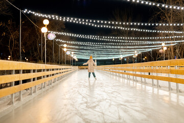 Little girl on skating rink