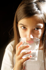 girl at home drinking water