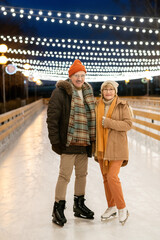 Mature couple skating together