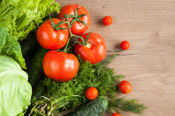 Healthy eating. The concept of healthy food, fresh vegetables on a wooden background. View from above. Copy space.
