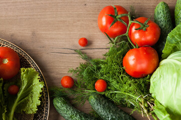 Healthy eating. The concept of healthy food, fresh vegetables on a wooden background. View from above. Copy space.