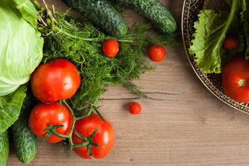 Healthy eating. The concept of healthy food, fresh vegetables on a wooden background. View from above. Copy space.