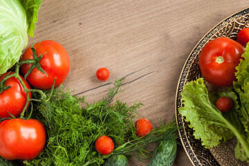 Healthy eating. The concept of healthy food, fresh vegetables on a wooden background. View from above. Copy space.