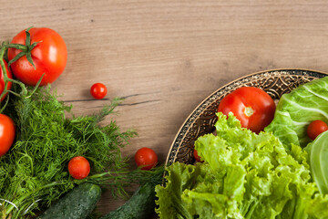 Healthy eating. The concept of healthy food, fresh vegetables on a wooden background. View from above. Copy space.