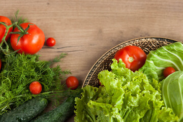 Healthy eating. The concept of healthy food, fresh vegetables on a wooden background. View from above. Copy space.