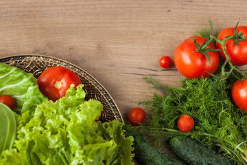 Healthy eating. The concept of healthy food, fresh vegetables on a wooden background. View from above. Copy space.