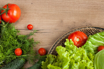 Healthy eating. The concept of healthy food, fresh vegetables on a wooden background. View from above. Copy space.