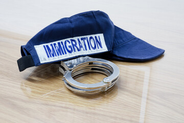 Identification cap and handcuffs of immigration service