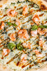 pizza with shrimp and cheese top  view