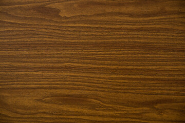 the background is dark wood with a contrasting pattern