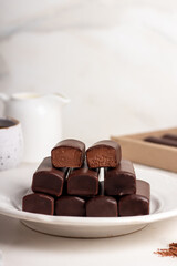 Glazed curds chocolate on white plate. Dessert chocolate with glazed cheese on marble background. 