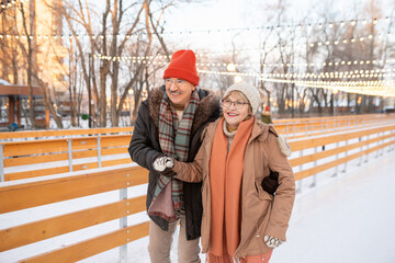 Couple learning to skate