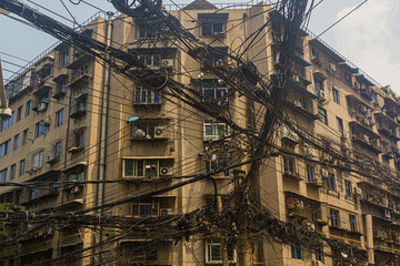 Fototapeta premium Chaos of wires on a street in Xi'an, China