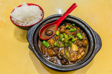 Meal in China - meat, peppers, mushrooms and rice