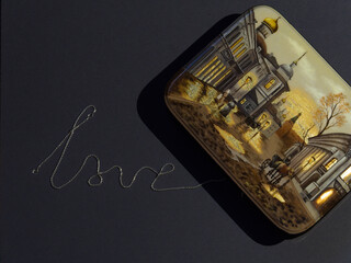 Valentine's Day. Jewelry box and silver chain put in the shape of the word love