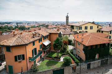 Fototapeta premium Top view of houses and street of old Italian city of Bergamo. City panorama.
