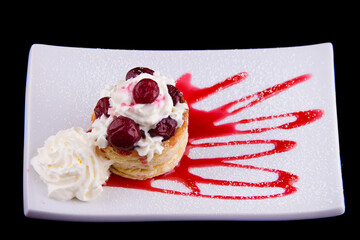 Curd dessert Drunk cherry made of puff pastry with mascarpone cheese and alcohol-soaked cherries