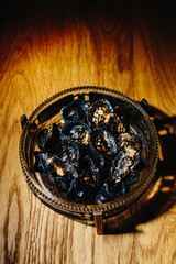 Plate of black dumplings