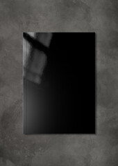 Black Booklet cover template on dark concrete background