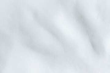 Obraz premium Wall with white curved plaster. Poorly done work on plastering the wall.